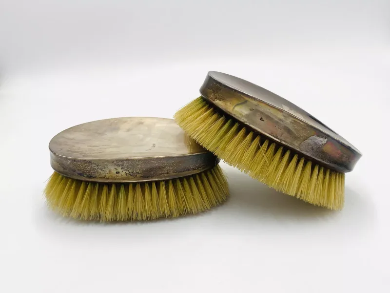 A pair of silver backed clothes brushes, indistinct hallmarks