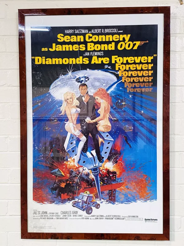 A framed and glazed James Bond poster, 'Diamonds Are Forever'. 68cms wide x 105cms high