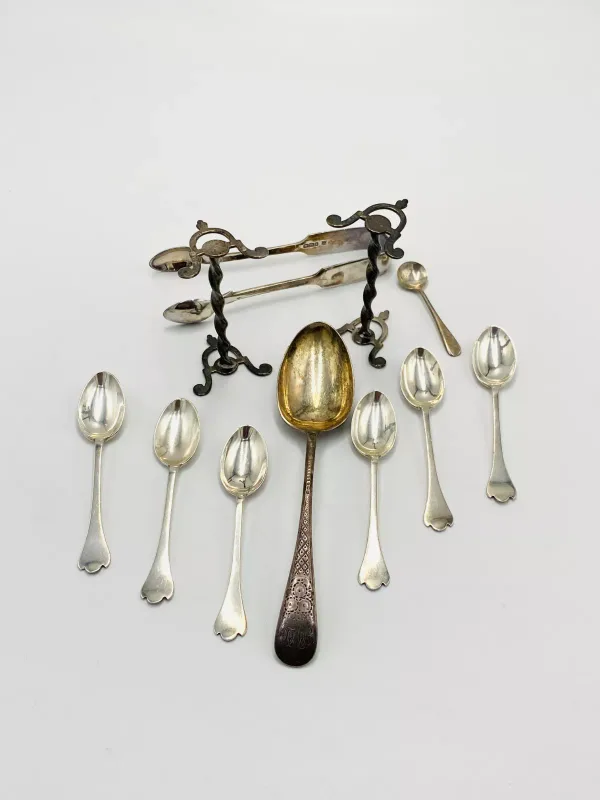 A set of six silver tea spoons together with other items of silver