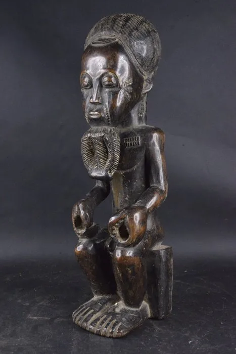 Statue depicting a Blolo Bian (Husband of the Afterlife) - Baule - Côte d'Ivoire