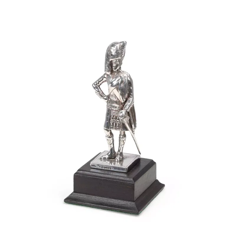 A Silver Figure Of A Highland Officer by Camelot Silverware Ltd, Sheffield 2002, modelled standing in full dress with feather bonnet, doublet, plaid