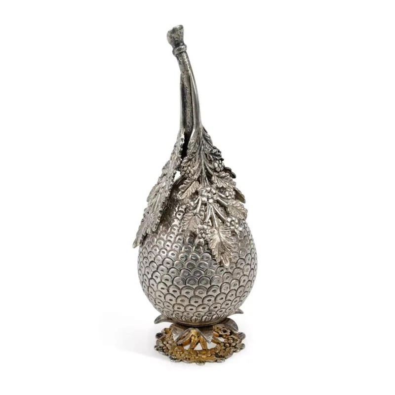 An Ottoman Silver Rosewater Sprinkler Tughra mark, of pear-shaped cone form, overlaid with cast pierced trailing leaves, on a gilt cast base.