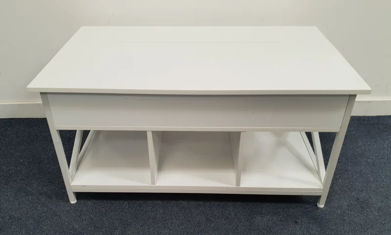 White Contemporary Metamorphic Coffee Table of brushed metal frame, the larger top section lifting to reveal interior storage compartments