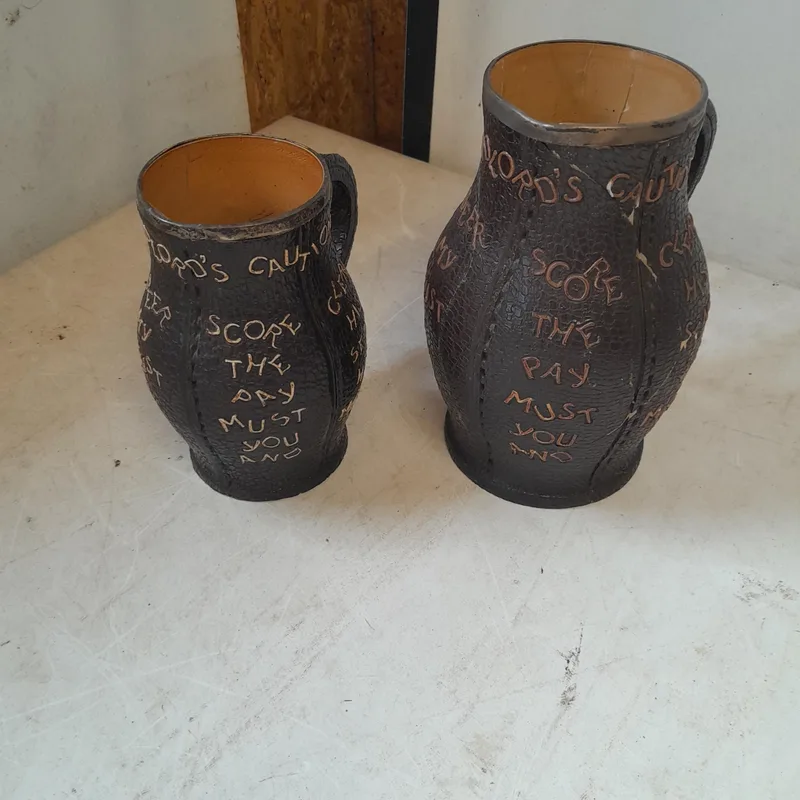 2 x Doulton Slaters patent stoneware silver rimmed motto tankards both heavily restored and one other without silver rim