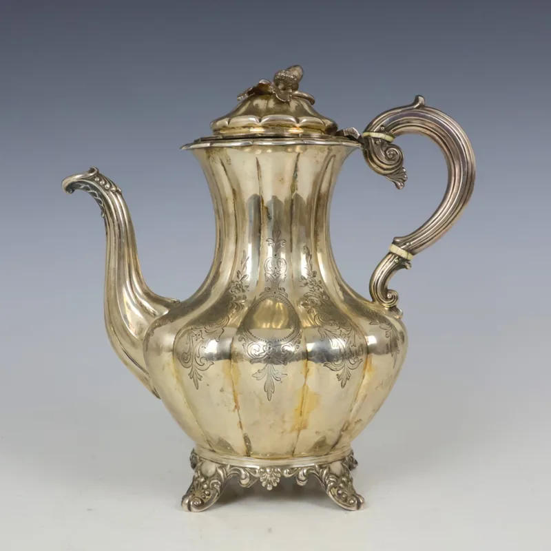 A Victorian silver coffee pot, Joseph & Albert Savory, London 1844, the acorn finial above melon fluted body upon four cast feet,