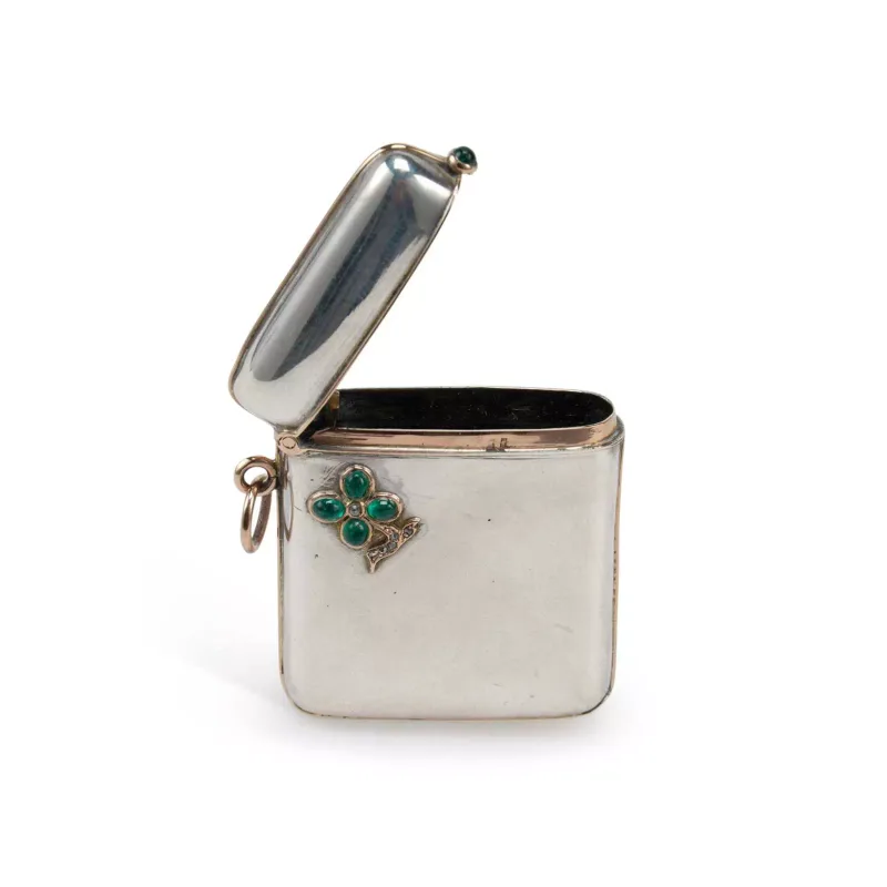 A Continental Silver, Gold And Gem-Set Vesta Case possibly French, marks worn, of curved rectangular form with a hinged cover, having gold mounted borders