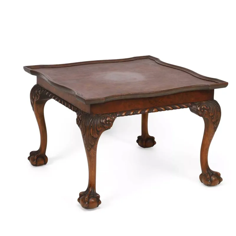 A Walnut Coffee Table 20th Century, in the George II taste, the shaped top within a moulded gallery above a gadrooned frieze