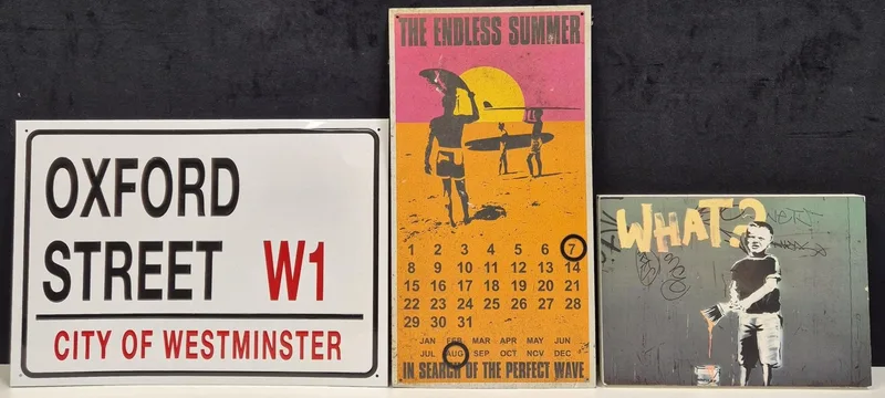 Two reproduction metal signs, together with a Banksy print on wood block