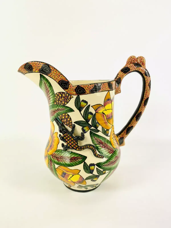 A large Ardmore Studio pottery jug with applied crocodile decoration, fully marked to the underside 'Made by Betrice, painted by Dttilih