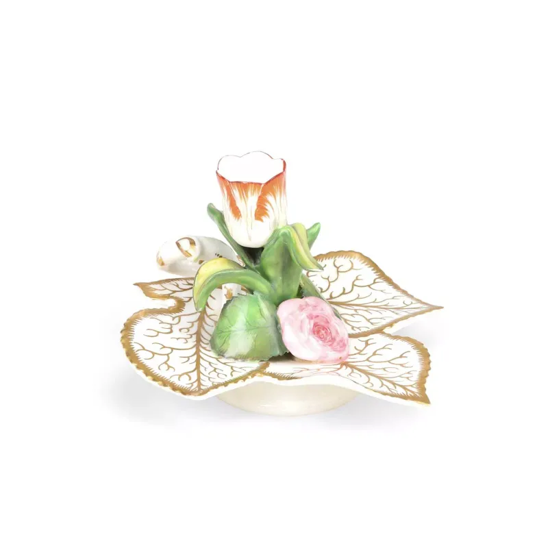 An English Porcelain Chamberstick circa 1830, the dish moulded as overlapping leaves gilt with veins and scrolling tendrils within serrated gilt edges