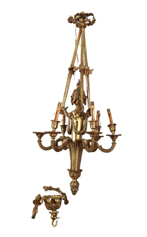An Early 20th Century Guilt Brass Six Branch Hanging Light Fitting with ribbon-tied suspension rods above scrolling arms