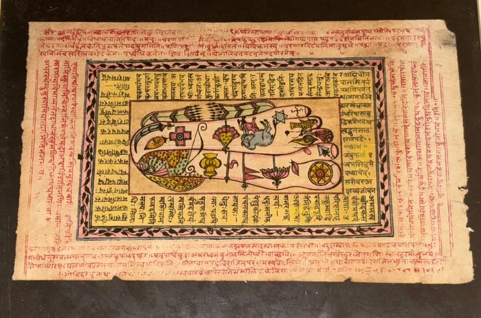 Old page from an Indian manuscript illustrating Vishnupuda, surrounded by inscriptions in ink. - Paper - India - late 19th - early 20th century