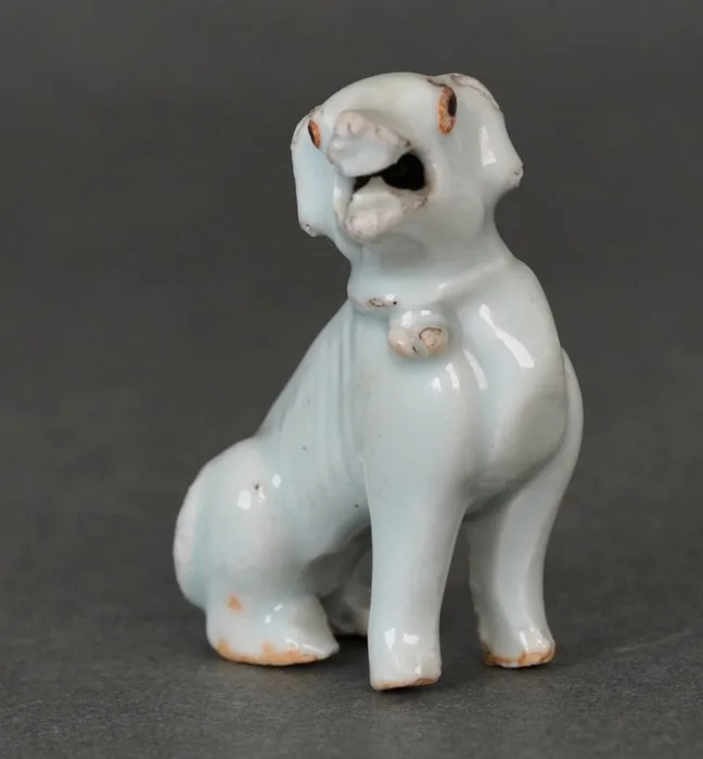 Qingbai Glazed - Seated Hound or Dog With Black Oxide Eyes and Open Mouth - Curled Tail and Collar - Porcelain - China - Yongzheng (1723-1735)