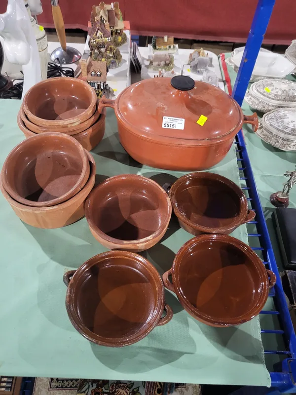 A Le Crueset Casserole Pot and cover, with a quantity of terracotta pots