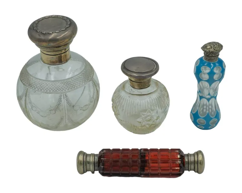 A collection of silver-mounted scent bottles