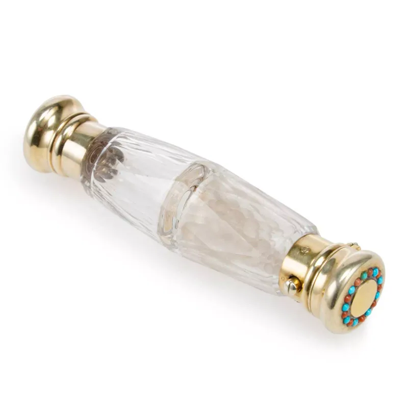 A Victorian Silver-Gilt Mounted Cut-Glass Double Scent Bottle apparently unmarked, late 19th Century, the body of tapering facet-cut form