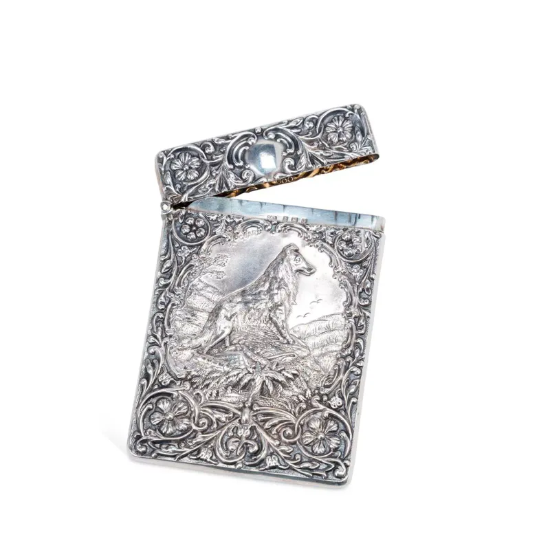 An Edwardian Silver Card Case by Crisford & Norris Ltd, Birmingham 1908, of rectangular form with rounded edges and a hinged cover