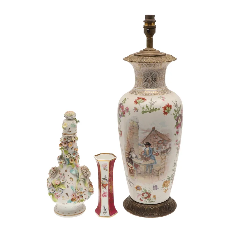 A Continental Floral Encrusted Porcelain Jar and Stopper, a Porcelain Spill Vase and a Porcelain Table Lamp