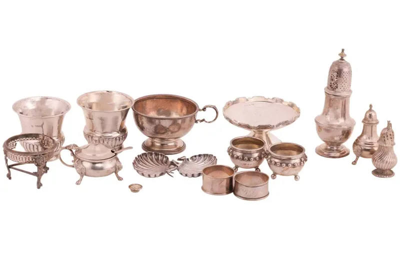 A collection of mixed silver table wares, comprising a silver sugar caster by Mappin & Webb Ltd, Birmingham 1938, of baluster form with pierced cover