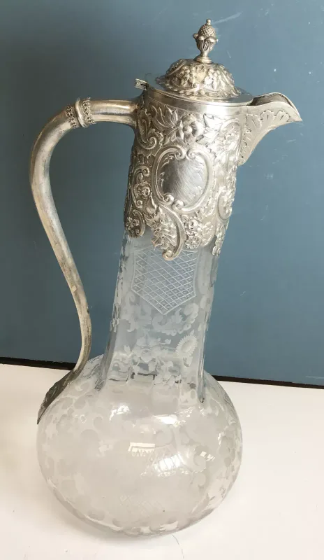 A Victorian silver mounted cut glass claret jug of squash form (by Edward Hutton for William Hutton & Sons, London 1893)