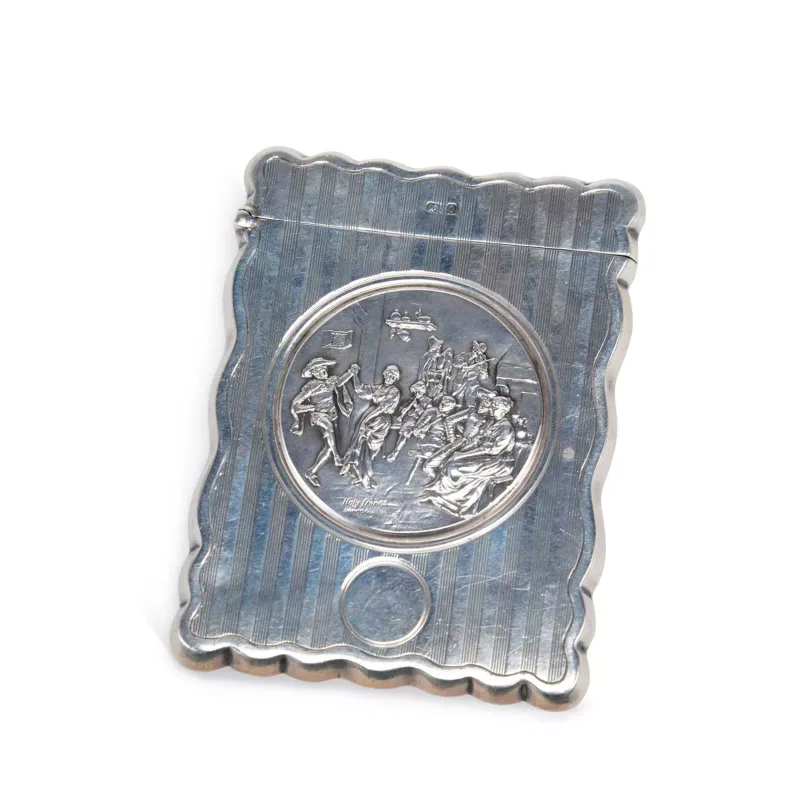 An Edwardian Silver Card Case by William M Hayes, Birmingham 1908, of shaped rectangular form with reeded engine-turned decoration