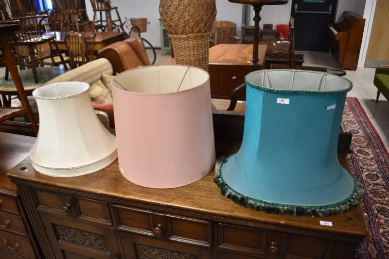 A trio of mid-to-late 20th-century fabric lampshades, each of varying form and colour