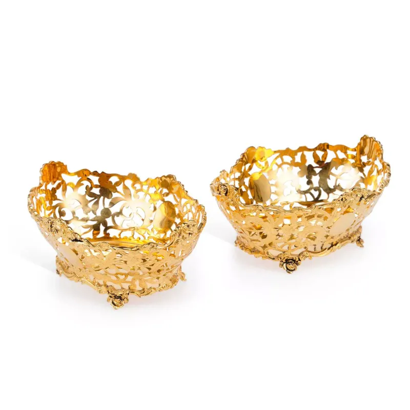 A Pair Of George V Silver-Gilt Pierced Baskets by C.S.Harris & Sons Ltd., London 1921, of oval form with scroll and foliate cast rims