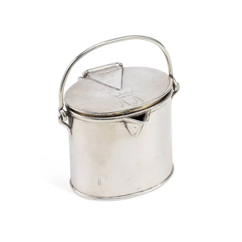A Victorian Novelty Silver Milk Pail Cream Jug maker's mark T.B., London 1882, of oval form with a hinged cover, sparrow beak spout and a swing handle