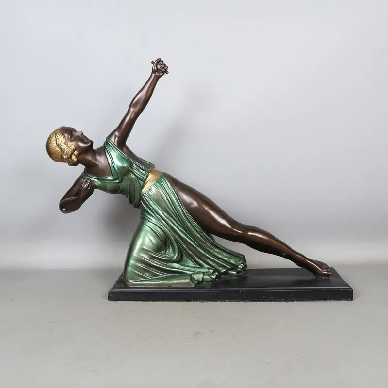 An Art Deco Style Bronze Effect Figure