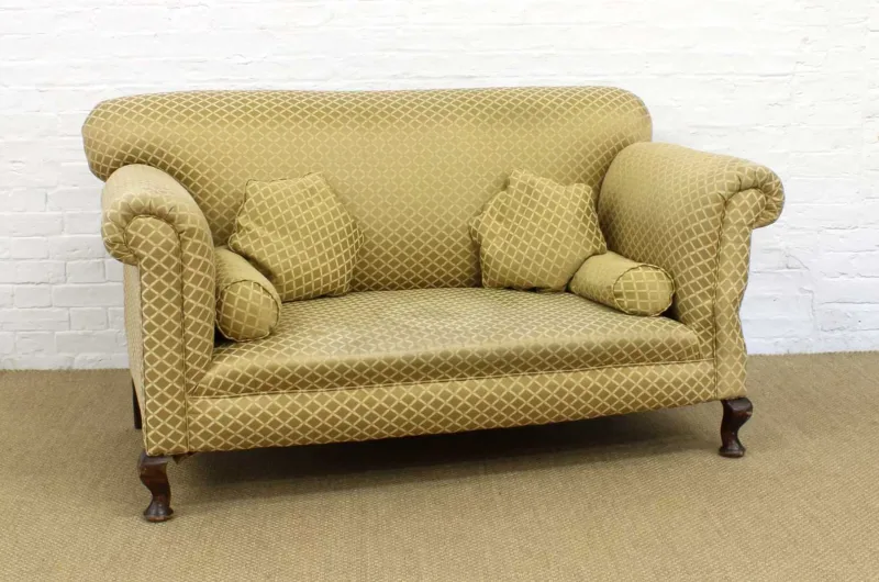 A Late 19th/Early 20th Century Chesterfield-Type Drop-Arm Settee A Late 19th/Early 20th Century Chesterfield-Type Drop-Arm Settee