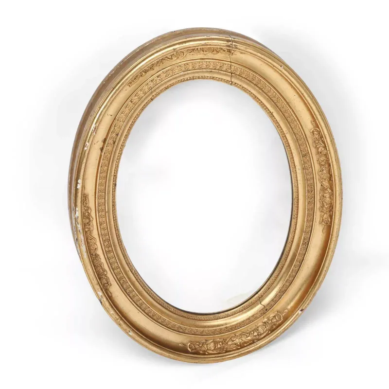 An Oval Giltwood Wall Mirror 19th Century, the moulded frame with foliate mouldings enclosing an oval plate.