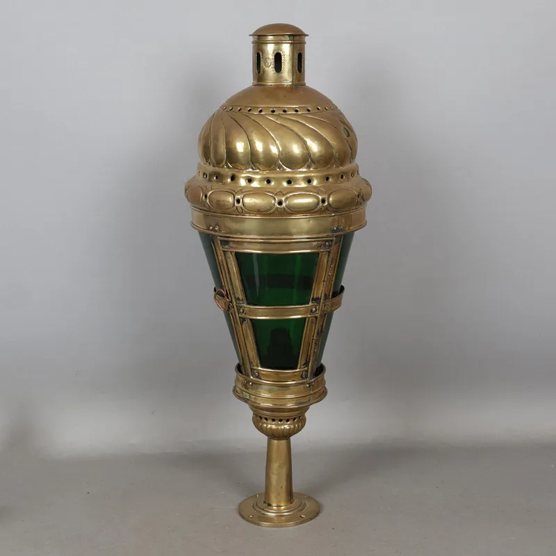 A Large Early 20th Century Brass and Green Glass Coaching Style Lamp