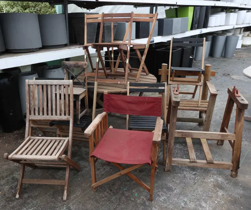 A group of garden furniture The set consisting of a folding circular table, a set of four folding chairs, a set of three folding chairs