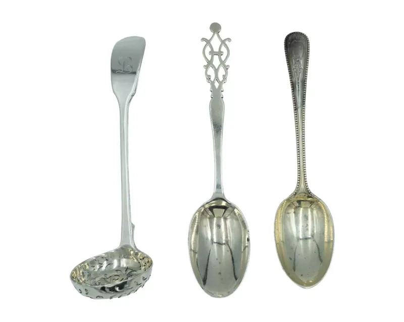 A silver tea strainer by Mary Chawner