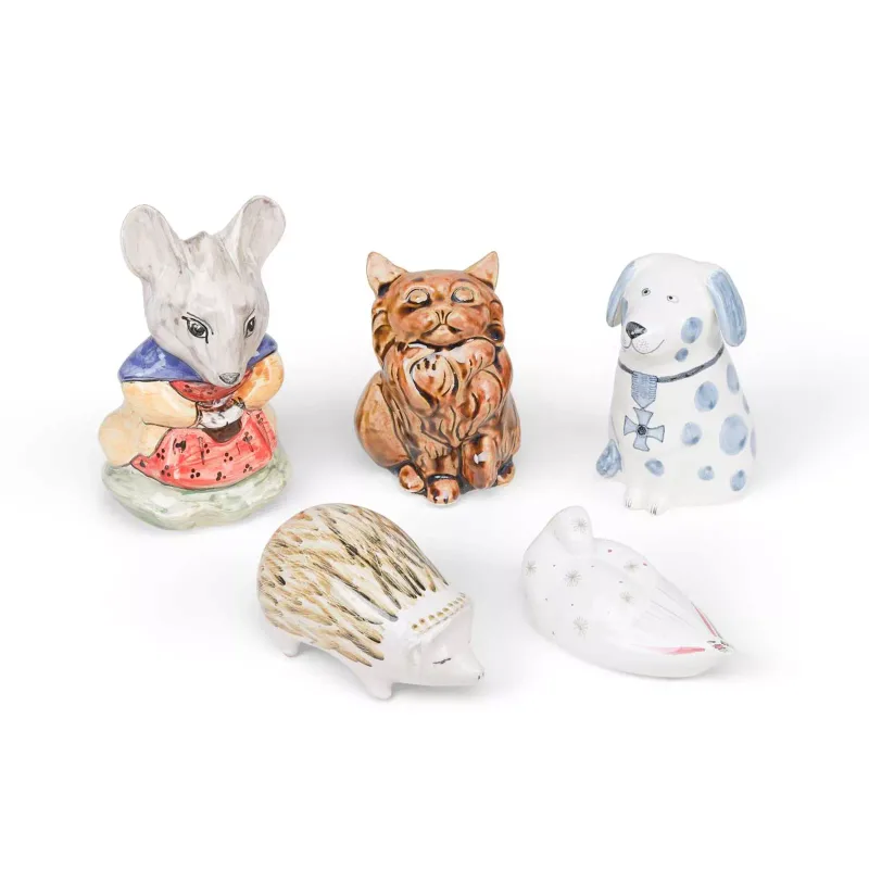 Five Rye Pottery Models Of Animals comprising a dressed mouse, a seated cat, a spotted dog with a medal, a hedgehog and a bird, two by David Sharp