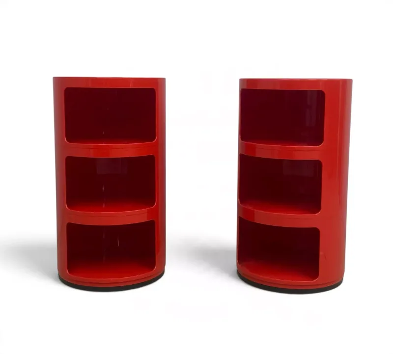 A pair of retro 1960s style red composite moulded Componibili bedside tables by Anna Kastelli for Kartell with maker's marks