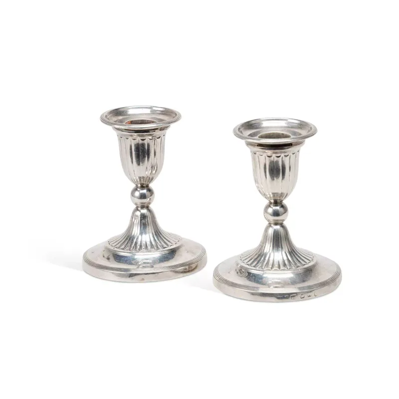 A Pair Of George III Silver Dwarf Candlesticks by John Green, Roberts, Mosley & Co., Sheffield 1801, each of circular form with detachable sconces