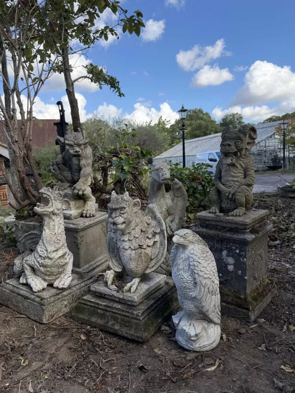 A group of six garden sculptures The set consisting of three horned beasts, two dragons and an eagle