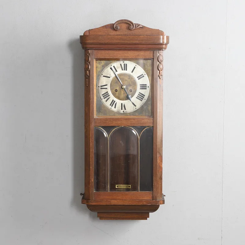 An Oak Cased Wall Clock