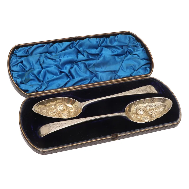 A Cased Matched Pair of Silver Berry Spoons