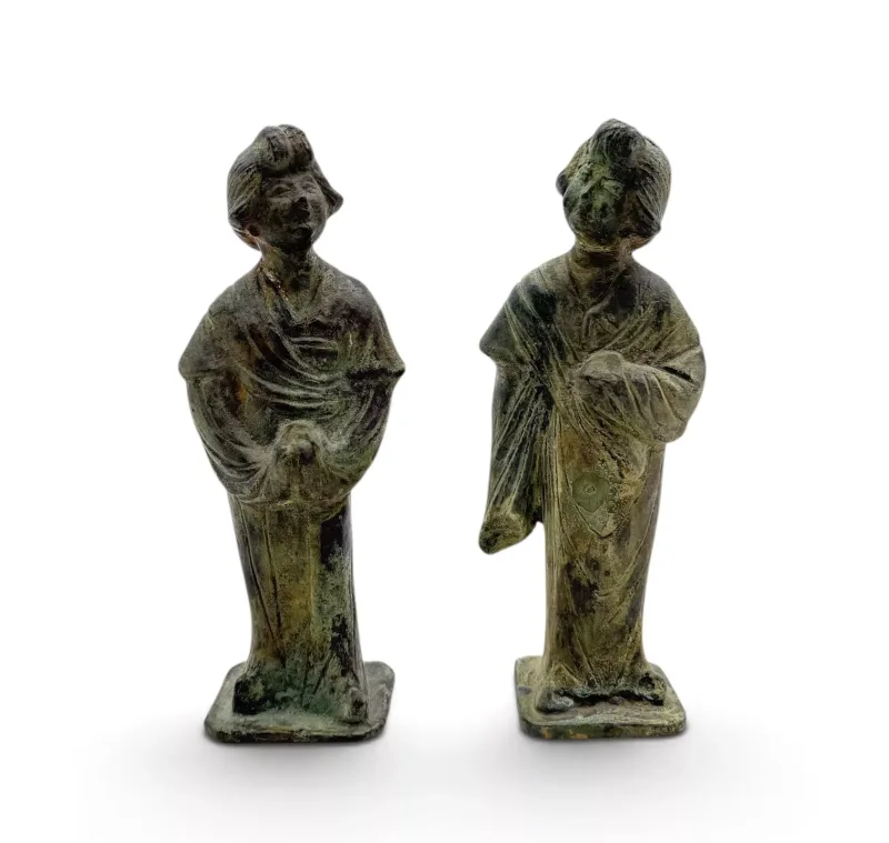 A Pair Of Japanese Bronze Figures Of Women In Kimonos Modelled on square plinth bases.