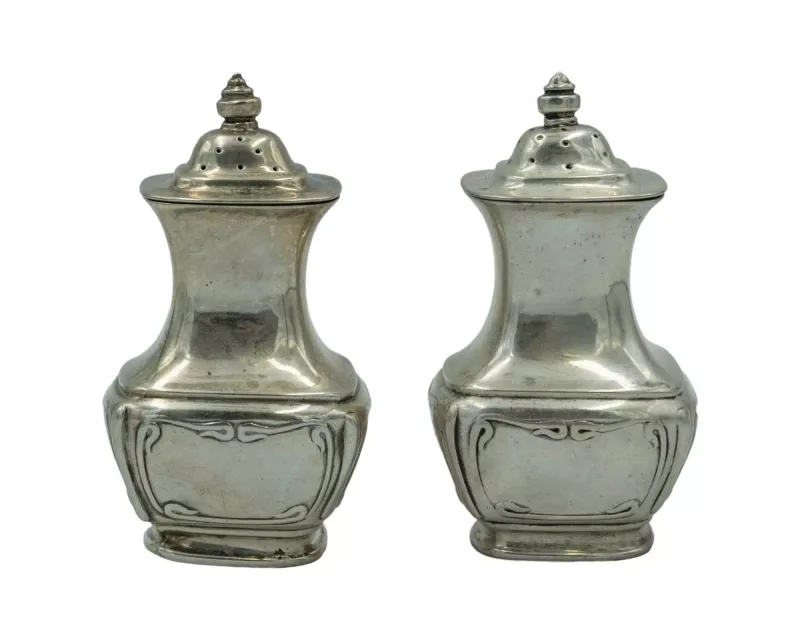 A pair of silver pepperettes by Horace Woodward & Co Ltd