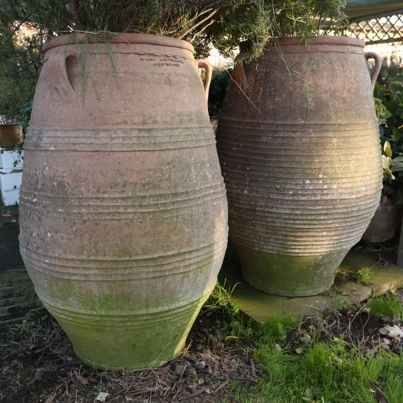 Two terracotta pithoi type jars Each jar with three lug handles and ring turned decoration