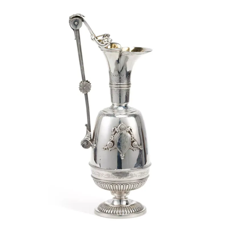 A Large Victorian Silver Water Jug Or Wine Ewer maker's marks rubbed, London 1865, of cylindrical form, with a tapering neck