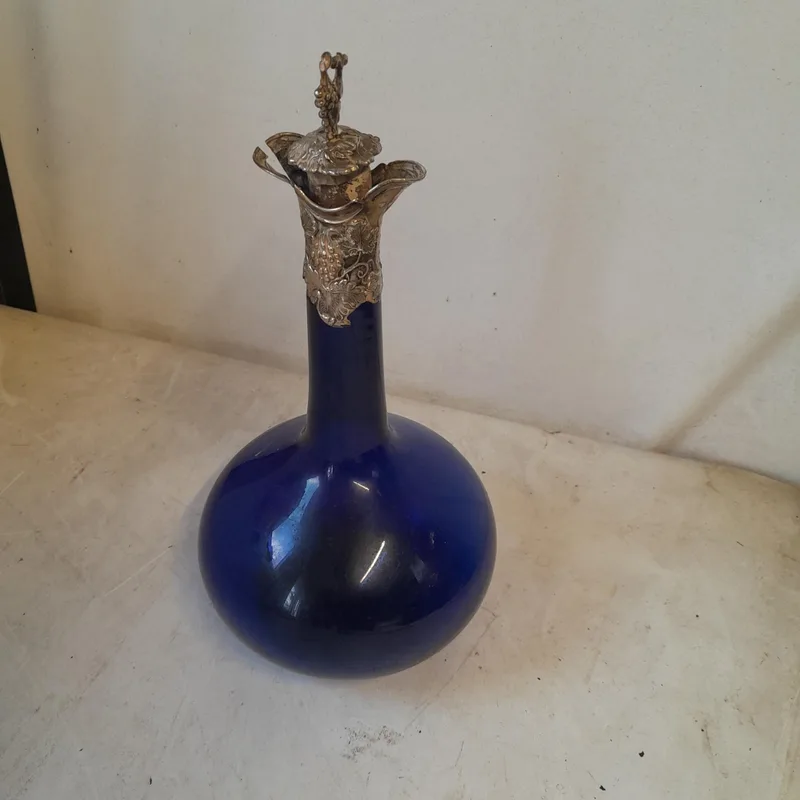 Victorian Bristol cobalt blue glass decanter with silver top, note tear to silver but bottle good