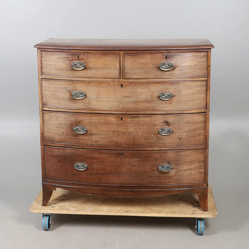 A Nineteenth Century Bow Fronted Chest of Two Short and Three Long Drawers
