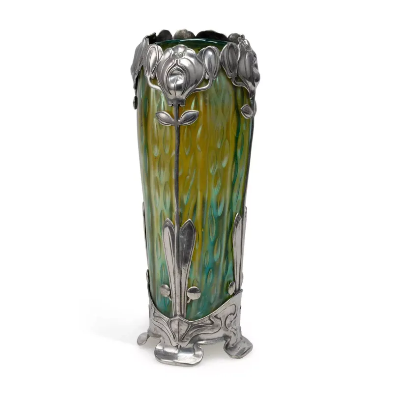 An Art Nouveau Iridescent Green Glass Vase With Pewter Mounts in the manner of Loetz/ Kralik, of cylindrical form in iridescent green glass with ellipse motif
