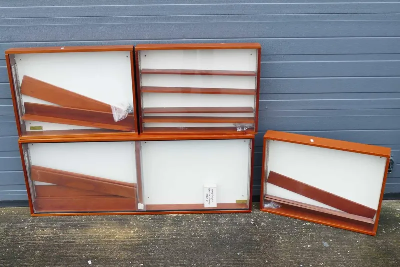 Wooden Display Cabinets An array of four wooden wall mounted display cabinets