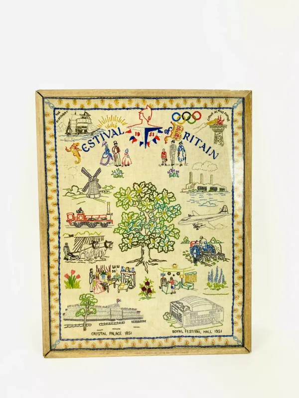 A framed decorative hand stitched embroidery titled 'The Festival Of Britain, 1951'. 39cms wide x 49cms high (overall size)