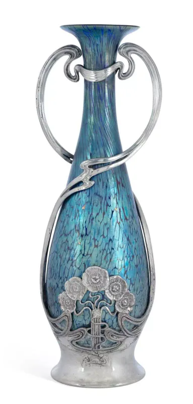 A Loetz Iridescent Glass Vase In An Art Nouveau Pewter Mount Circa 1900 of tapering ovoid form with a flared trumpet neck